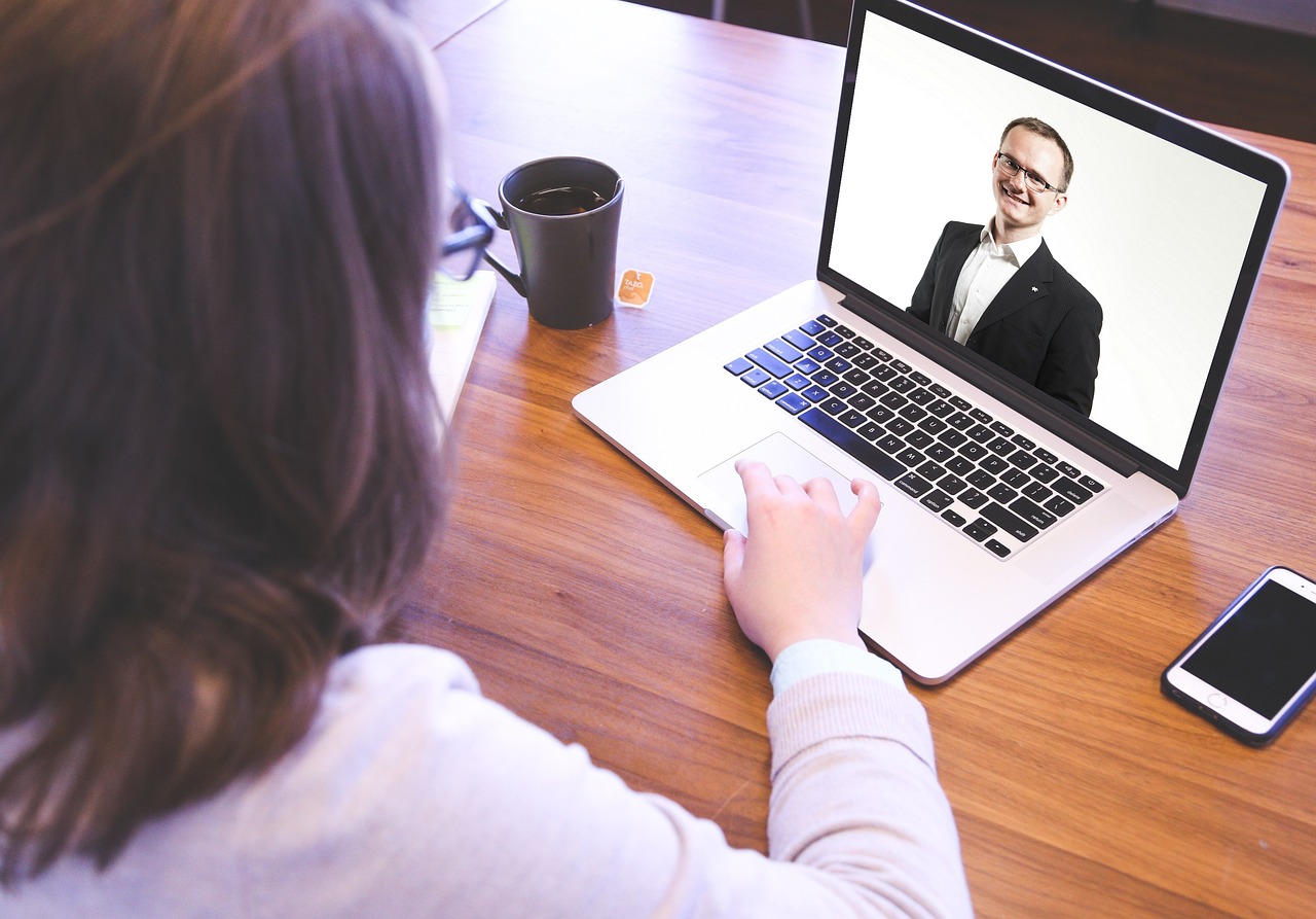 CXC Talent staff recruitment image showing candidates in video interviews for apartment and multifamily housing jobs.